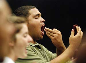 A member practicing vocal exercises