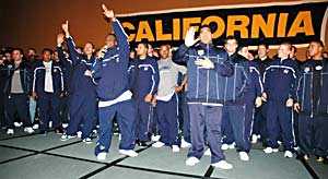 Cal football playyers onstage at the rally