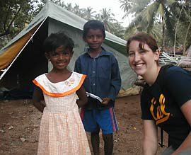 Ann Marie Edwards poses with refugee children