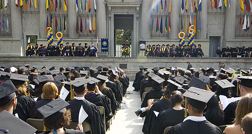 Graduates face the stage at convocation