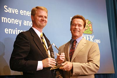Nathan Brostrom accepts the campus's Flex Your Power Award from Gov. Schwarzenegger