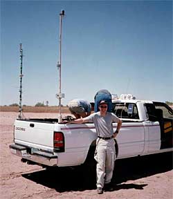  Greg Delory and a truck instrumented to measure electric fields that he used to chase dust devils around Arizona (2002).