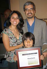 Alvaro Huerta accepts the Thomas I. Yamashita Prize,accompanied by his wife,Antonia Montes, and son,Joaquin. (Christine Trost photo)