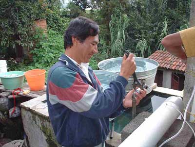  Florentino Mota, a community outreach worker in Mexico, installs a UV Tube developed by UC Berkeley researchers.