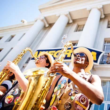 Cal band players with buttons on vest