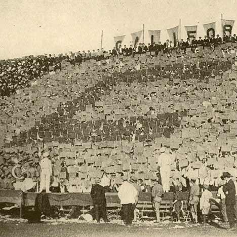 Historic photo of fans holding cards from the bleachers