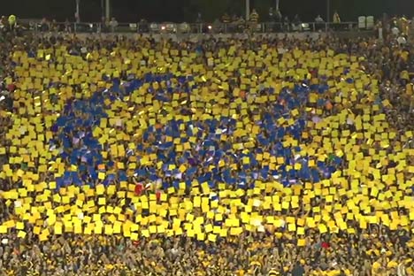 Cards held up in bleachers that spell out Cal