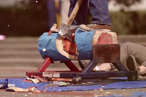 An axe chopping through a log