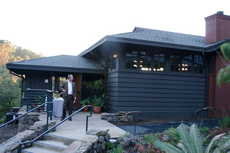 Building with stairway leading to porch area