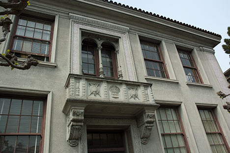 Facade of building with ornate carved balcony