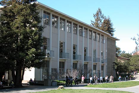 Building with people walking along pathway