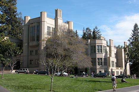 Building with lawn in front and blue sky