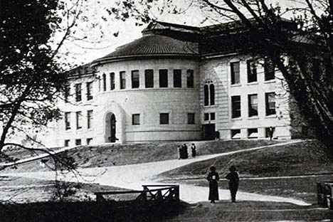Black and white photo of building with cylindrical front.