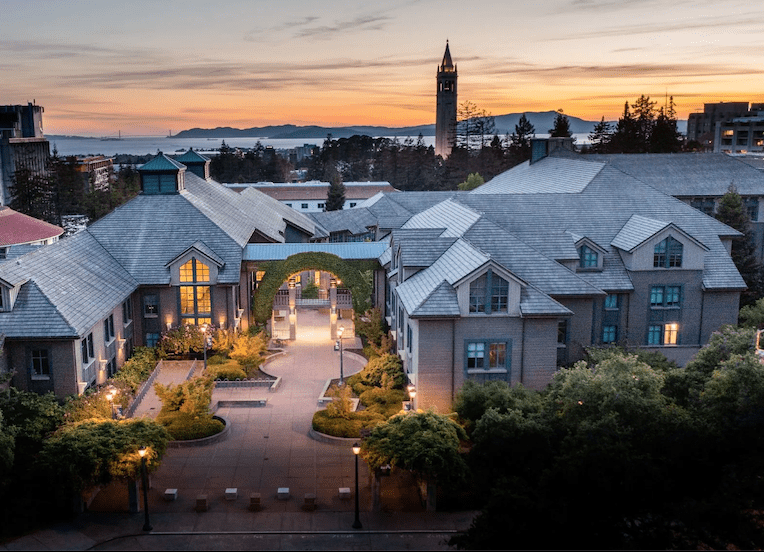 aerial view of Haas building with Campanile tower in the background at sunset