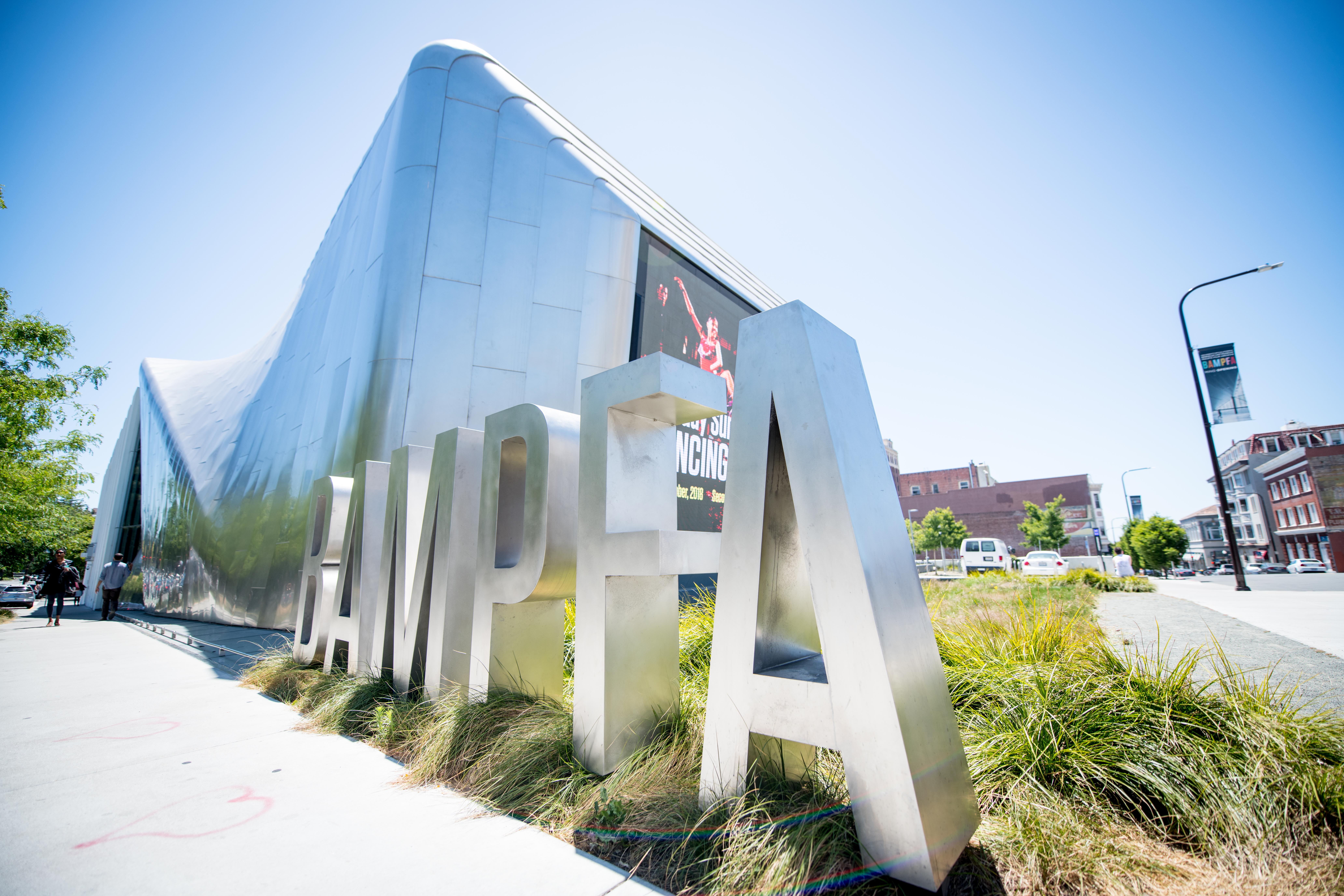 Exterior of the BAMPFA building featuring large letters spelling out the name of the organization that sit next to the building